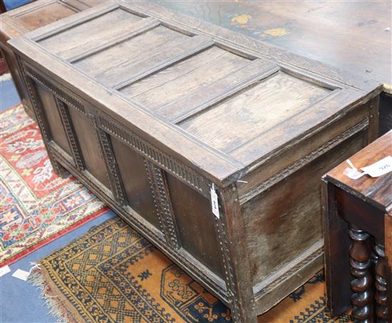 An 18th century oak panelled coffer W.134cm